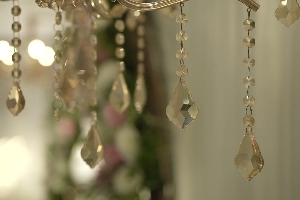 Crystal chandeliers held in shallow focus.